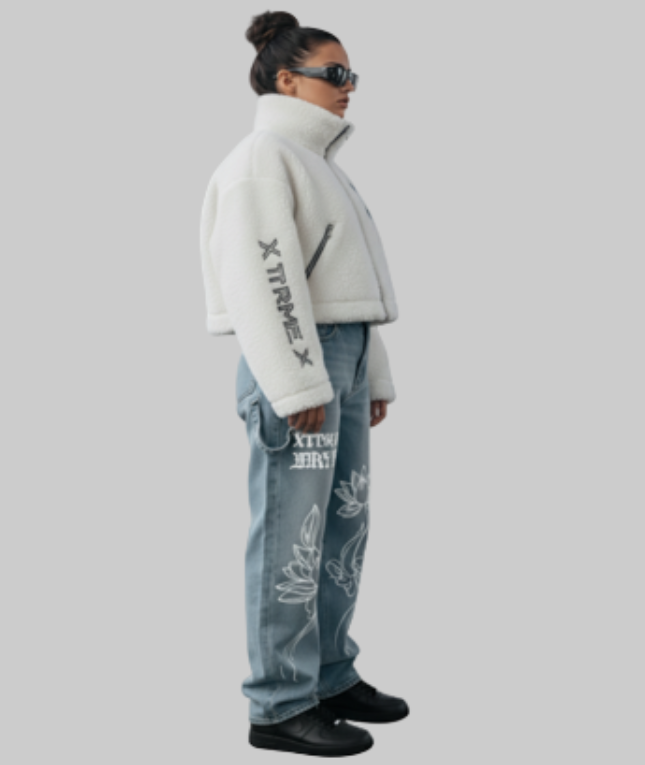 Person wearing a light gray jacket and blue jeans with text on a plain background