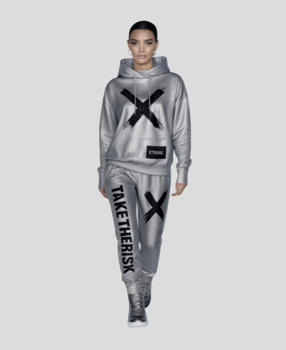 Person wearing a gray tracksuit with black 'X' and text design on a white background