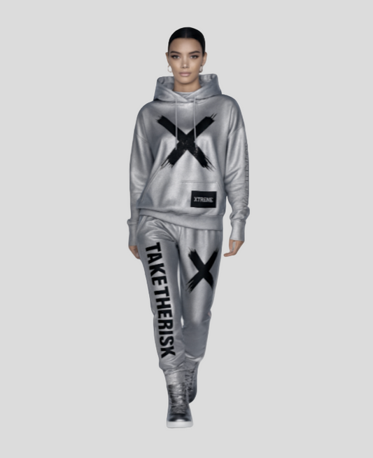 Person wearing a gray tracksuit with black 'X' and text design on a white background