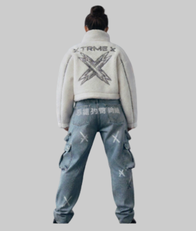 Person wearing a white jacket with 'Xtreme' branding and blue jeans with similar designs on a gray background