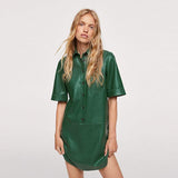 PU leather short-sleeved green mini dress.